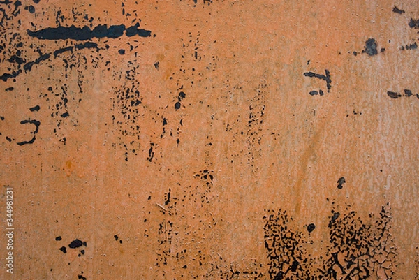 Fototapeta The texture of an iron sheet painted with paint that is subject to corrosion. External part of the object.