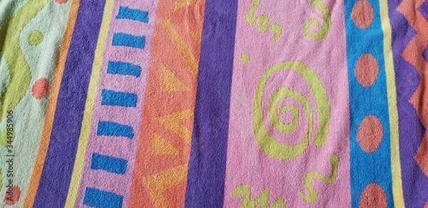 Fototapeta Colorful beach towel with varied patterns and fun designs. 
