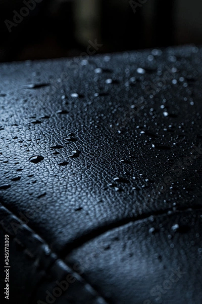 Fototapeta Dark leather texture with rain drops on vertical composition