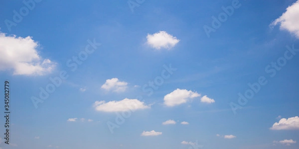 Obraz Blue sky background with clouds.