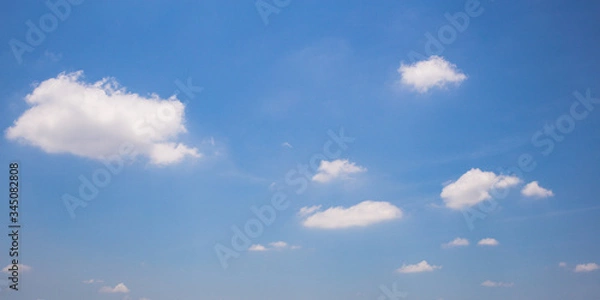 Obraz Blue sky background with clouds.