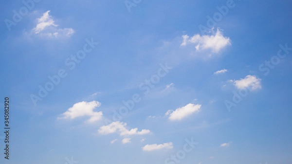 Obraz Blue sky background with clouds.