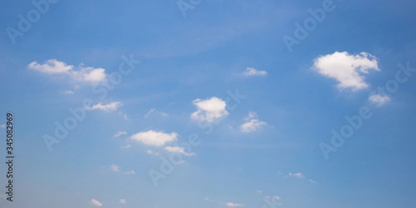 Obraz Blue sky background with clouds.