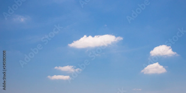 Obraz Blue sky background with clouds.