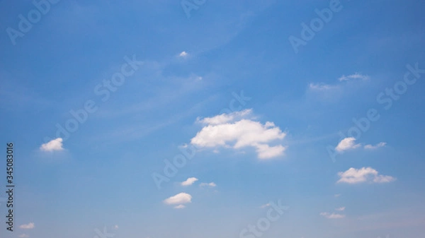 Obraz Blue sky background with clouds.