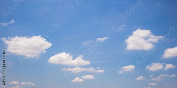 Obraz Blue sky background with clouds.
