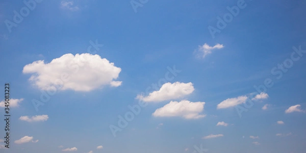 Obraz Blue sky background with clouds.