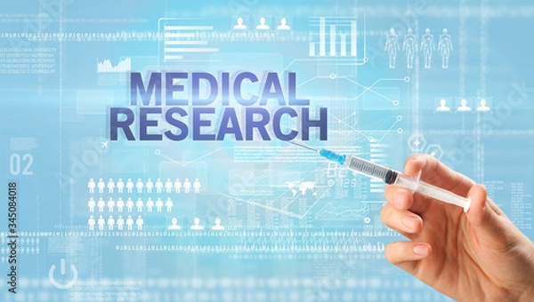 Fototapeta Close-up view of doctor's hand in a white glove holding syringe with MEDICAL RESEARCH inscription, healthcare and medical concept