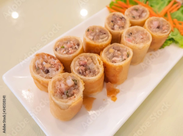 Obraz crispy spring rolls on white dish