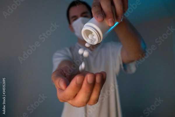 Fototapeta man in a mask with medicine