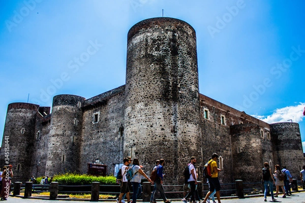 Fototapeta Castello di Catania, Italy, in Sicily. View of the sky among the rock of Mediterranean architecture