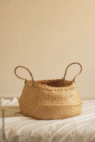 Fototapeta warm colors photo at a home interior of a basket over the sofa