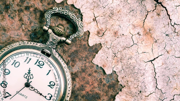 Fototapeta Vintage pocket watch showing time with textured background. concept of time