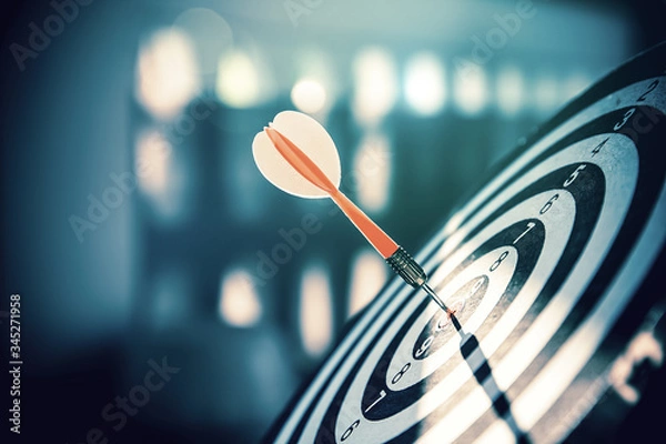 Fototapeta Bullseye(bull's-eye) or dart board has dart arrow hitting the center of a shooting target for business targeting and and marketing goal concetps.