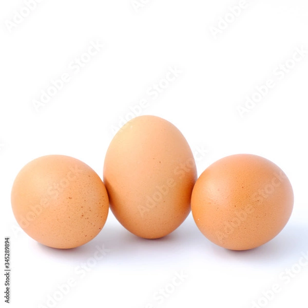 Fototapeta Close-up top view of organic raw eggs on white background with copy space for your text, healthy eating concept.
