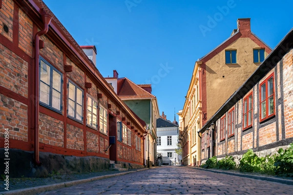 Fototapeta Typical architectural street scene from the small Swedish city Ystad in south Sweden.