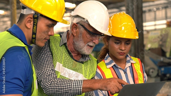 Fototapeta Team Of Engineers Having Discussion