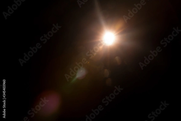 Obraz Abstract Natural Sun flare on the black background.