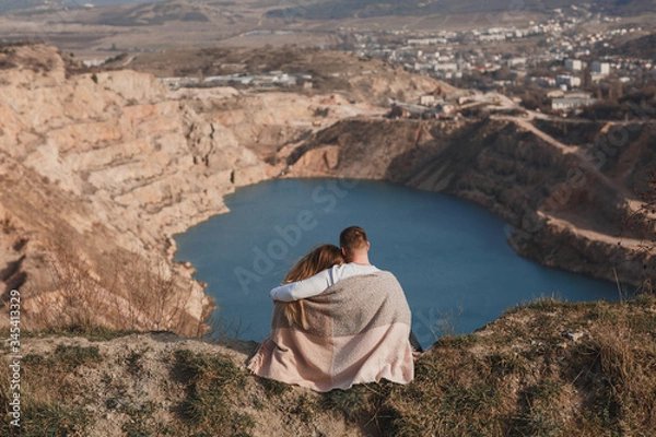 Fototapeta a couple in love admires the view of a mountain lake