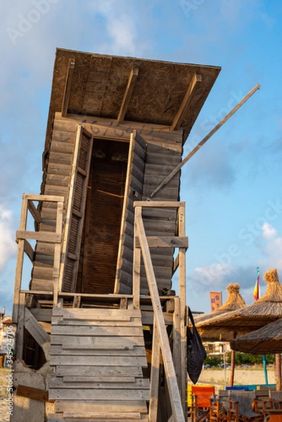 Fototapeta Wooden baywatch tower at the beach. Front view.