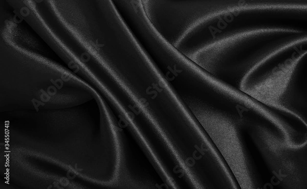 Fototapeta Smooth elegant black silk or satin texture as abstract background. Luxurious background design