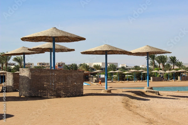 Fototapeta tropical beach with umbrellas
