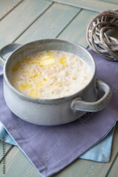 Fototapeta Milk soup with noodles and dough in a ceramic bowl