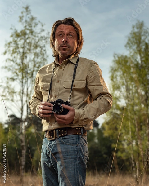 Obraz Nature photographer in nature reserve at sunrise during spring.