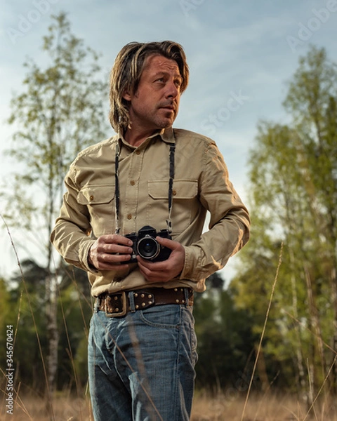 Obraz Nature photographer in nature reserve at sunrise during spring.