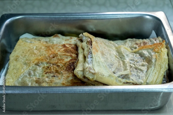 Fototapeta "Murtabak" or pancake with mixed meat or chicken and vegetable in the tray