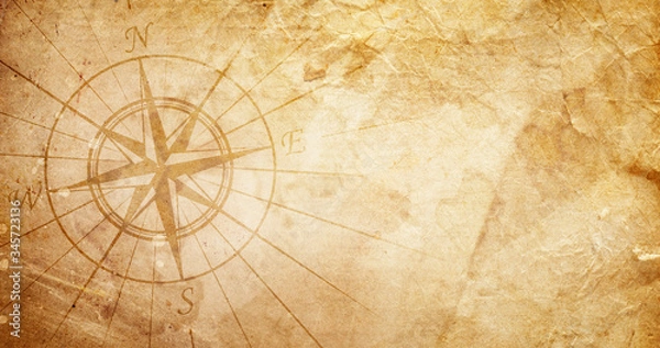 Fototapeta Old compass on paper background