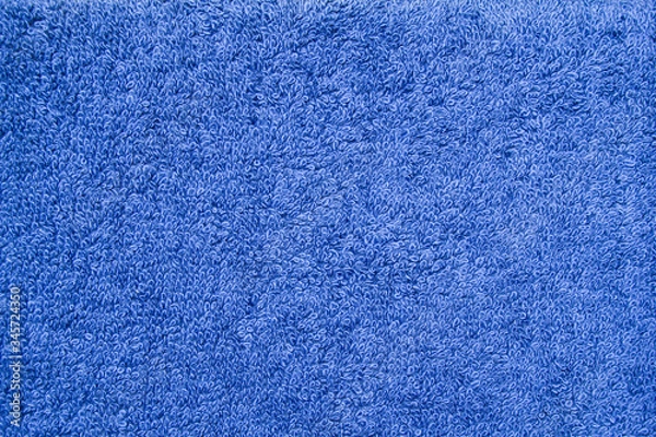Fototapeta Closeup blue bath terry towel. Blue textile fabric texture background