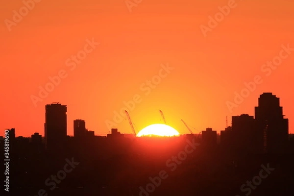 Obraz Zachód słońca  nad miastem
