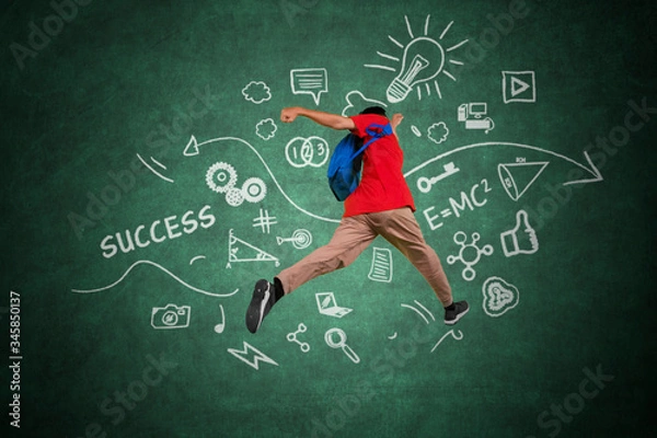 Fototapeta Male college student leaping with doodles