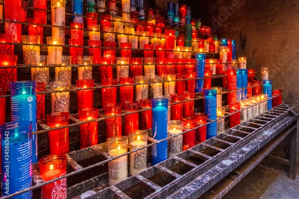 Obraz Candles in Montserrat monastery on mountain in Barcelona, Catalonia.