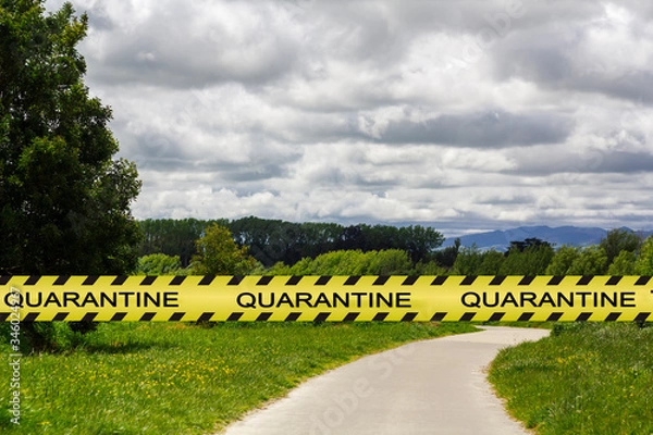 Fototapeta Coronavirus quarantine warning tape with empty park on the background. Covid-19 lockdown concept