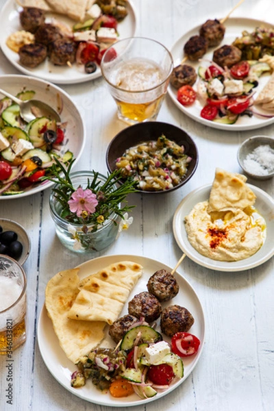 Fototapeta Greek meze meal with lamb meatballs, hummus and salad