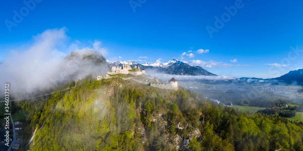 Obraz aerial view to ruin eherberg with rope bridge and mountain hahnenkamm in background