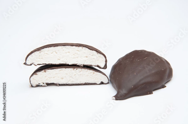 Obraz chocolate-covered marshmallows cut on a white background