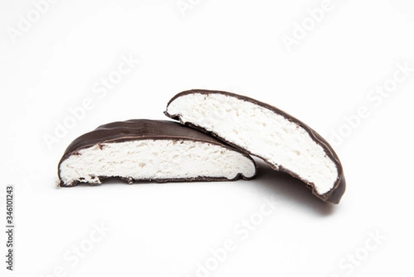 Obraz chocolate-covered marshmallows cut on a white background