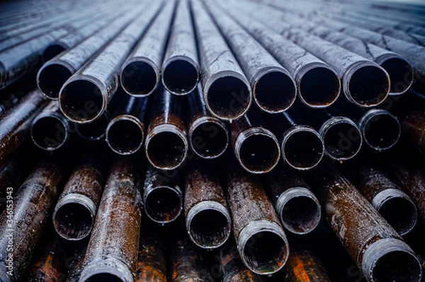 Fototapeta Construction of Oil and Gas Pipeline, horizontal directional drilling. Drilling of oil and gas wells. In the foreground, a threaded joint of pipes