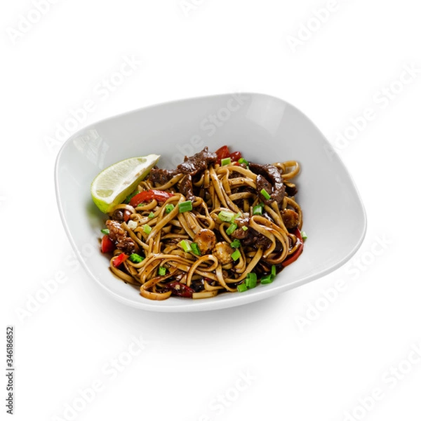 Fototapeta Fried udon noodles in a wok with beef, bell pepper and broccoli. Traditional asian food. Isolated on a white background.