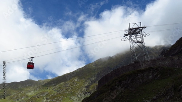 Obraz Cable Cart Sliding Down a Lush Green Mountain
