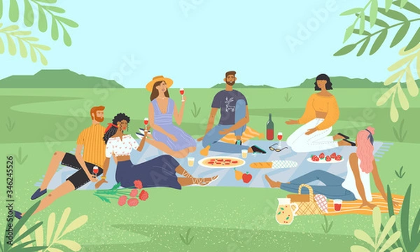 Fototapeta Smiling friends relaxing at a picnic in the park. Happy men and women drinking wine and eating food on lawn. Group of stylish people having lunch with nature landscape view on the background