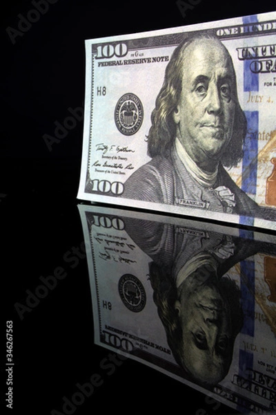 Fototapeta pack of hundred dollar bills with reflection