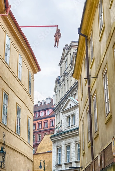 Fototapeta Prague, Czech Republic - 01.05.2019. The architecture of the old city of Prague. Man hanging out. Editorial use only