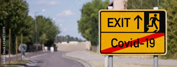 Obraz Yellow sign points away from Covid-19 to escape symbol