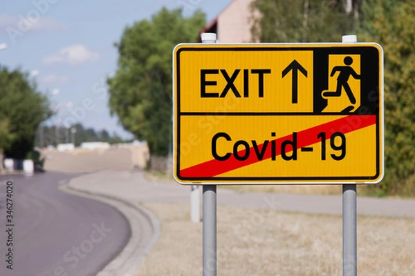 Obraz Yellow sign points away from Covid-19 to escape symbol