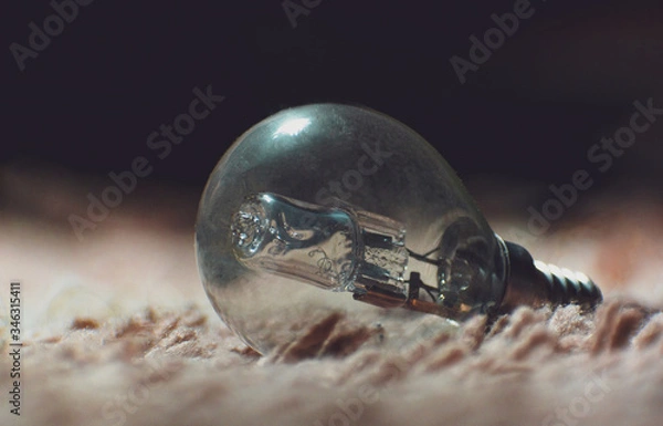 Fototapeta light bulb on black background 