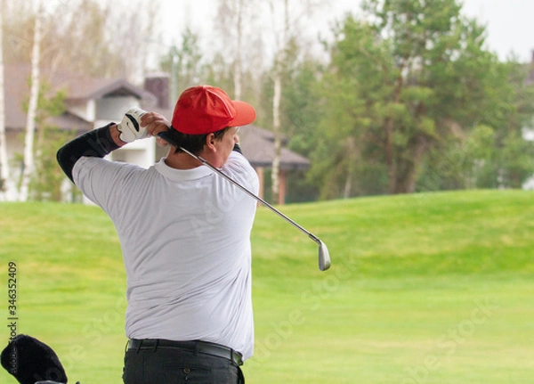 Fototapeta Player a during a golf game during a hit